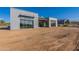 Contemporary home featuring a sleek exterior design with large windows and desert landscaping at 35065 N 83Rd Pl # 4, Scottsdale, AZ 85266