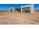 Modern home with unique architectural details, large windows, and desert surroundings at 35065 N 83Rd Pl # 4, Scottsdale, AZ 85266