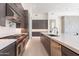Modern kitchen features a large center island, custom cabinetry, stainless steel appliances and tile flooring at 35065 N 83Rd Pl # 4, Scottsdale, AZ 85266