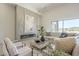 Inviting living room with fireplace, stylish decor, comfortable seating, and large windows offering natural light at 35065 N 83Rd Pl # 4, Scottsdale, AZ 85266