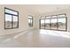 Large living space featuring several windows with an abundance of natural light at 35065 N 83Rd Pl # 4, Scottsdale, AZ 85266