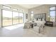 Bright main bedroom featuring tiled accent wall, neutral decor, and large windows with views of the landscape at 35065 N 83Rd Pl # 4, Scottsdale, AZ 85266