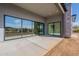 Covered patio featuring expansive glass doors, seamlessly blending indoor and outdoor living at 35065 N 83Rd Pl # 4, Scottsdale, AZ 85266
