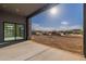 Covered patio overlooking the natural desert landscape, providing an outdoor living space at 35065 N 83Rd Pl # 4, Scottsdale, AZ 85266