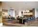 Open concept living and dining area with hardwood floors and modern light fixtures at 3832 E Highland Ave, Phoenix, AZ 85018