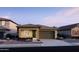 Single-story home with attached garage and landscaping at 43358 N Wollemi St, Queen Creek, AZ 85142