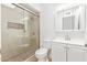 Bathroom featuring a walk-in shower with pebble flooring and a modern vanity at 5528 W Sunnyslope Ln, Glendale, AZ 85302