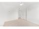 Bright bedroom with neutral carpet, white walls, closet, and a ceiling fan at 5528 W Sunnyslope Ln, Glendale, AZ 85302