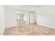 Bright bedroom with tiled floor, white walls, ceiling fan, and a sliding glass door at 5528 W Sunnyslope Ln, Glendale, AZ 85302