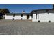 Mid-century modern home with freshly painted white exterior and landscaping at 5528 W Sunnyslope Ln, Glendale, AZ 85302