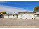 Charming white brick home featuring desert landscaping and a contemporary design at 5528 W Sunnyslope Ln, Glendale, AZ 85302