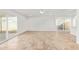 Spacious living room featuring tile flooring, ceiling fan, and sliding glass doors to the backyard at 5528 W Sunnyslope Ln, Glendale, AZ 85302