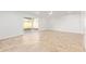 A bright, spacious living room with tile flooring and sliding glass doors to the backyard at 5528 W Sunnyslope Ln, Glendale, AZ 85302