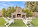 Stone outdoor fireplace with seating area at 6870 S Crestview Dr, Gilbert, AZ 85298