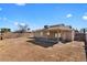 Expansive backyard with covered patio and privacy wall, ready for customization at 8328 W Fairmount Ave, Phoenix, AZ 85037