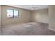 Spacious carpeted bedroom featuring a large window at 8328 W Fairmount Ave, Phoenix, AZ 85037