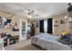 Bedroom featuring a window with curtains, ceiling fan, and furnishings at 8328 W Fairmount Ave, Phoenix, AZ 85037
