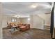 Cozy living room features wood-look floors, neutral walls, and staircase access to the second floor at 8328 W Fairmount Ave, Phoenix, AZ 85037