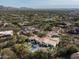 Expansive aerial view showcasing the home, pool, and golf course at 9290 E Thompson Peak Pkwy # 422, Scottsdale, AZ 85255