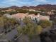 Aerial view of a luxurious home with mountain views at 9290 E Thompson Peak Pkwy # 422, Scottsdale, AZ 85255