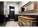 Unique bathroom with black and white tile and ornate vanity at 9290 E Thompson Peak Pkwy # 422, Scottsdale, AZ 85255