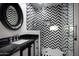 Modern bathroom with black and white chevron tile and marble vanity at 9290 E Thompson Peak Pkwy # 422, Scottsdale, AZ 85255