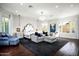 Luxurious main bedroom with a plush bed, sitting area, and hardwood floors at 9290 E Thompson Peak Pkwy # 422, Scottsdale, AZ 85255