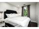 Elegant bedroom with a plush bed and dark wood flooring at 9290 E Thompson Peak Pkwy # 422, Scottsdale, AZ 85255
