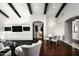 Open dining area with hardwood floors and a view into the living room at 9290 E Thompson Peak Pkwy # 422, Scottsdale, AZ 85255