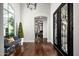 Elegant entryway with dark hardwood floors and ornate black doors at 9290 E Thompson Peak Pkwy # 422, Scottsdale, AZ 85255