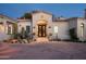 Spanish style home with double doors and desert landscaping at 9290 E Thompson Peak Pkwy # 422, Scottsdale, AZ 85255