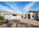 Three-car garage and elegant entryway of a stunning home at 9290 E Thompson Peak Pkwy # 422, Scottsdale, AZ 85255