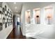 Bright hallway with hardwood floors and unique wall decor at 9290 E Thompson Peak Pkwy # 422, Scottsdale, AZ 85255
