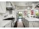 Large kitchen with marble countertops, high-end appliances, and backyard access at 9290 E Thompson Peak Pkwy # 422, Scottsdale, AZ 85255