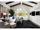 Living room boasts hardwood floors, high ceilings, and a stunning view at 9290 E Thompson Peak Pkwy # 422, Scottsdale, AZ 85255