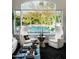Bright living room with large windows overlooking the pool and backyard at 9290 E Thompson Peak Pkwy # 422, Scottsdale, AZ 85255