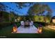 Alfresco dining area with large table and chairs on paved patio at 9290 E Thompson Peak Pkwy # 422, Scottsdale, AZ 85255