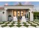 Relaxing patio with comfortable seating and a checkerboard patterned lawn at 9290 E Thompson Peak Pkwy # 422, Scottsdale, AZ 85255