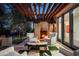 Relaxing patio with a fireplace, comfortable seating, and a pergola at 9290 E Thompson Peak Pkwy # 422, Scottsdale, AZ 85255