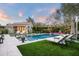Luxury pool area with lounge chairs and fire pit at 9290 E Thompson Peak Pkwy # 422, Scottsdale, AZ 85255