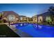 Stunning pool and patio area with outdoor seating and lighting at 9290 E Thompson Peak Pkwy # 422, Scottsdale, AZ 85255