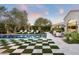 Checkered patio surrounds a refreshing pool, creating a stylish backyard at 9290 E Thompson Peak Pkwy # 422, Scottsdale, AZ 85255