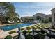 Checkerboard tiled patio surrounding a refreshing blue pool at 9290 E Thompson Peak Pkwy # 422, Scottsdale, AZ 85255