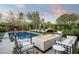 Relaxing poolside area with fire pit and comfortable seating at 9290 E Thompson Peak Pkwy # 422, Scottsdale, AZ 85255