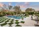 Inviting pool with a checkerboard lawn and water features at 9290 E Thompson Peak Pkwy # 422, Scottsdale, AZ 85255