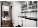 Convenient snack bar with glass shelving and a small sink at 9290 E Thompson Peak Pkwy # 422, Scottsdale, AZ 85255