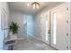 Bright entryway with double doors, tiled floors, and modern decor at 10226 N 171St Dr, Waddell, AZ 85355