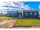 Modern home with gray brick and white accents, spacious yard at 10226 N 171St Dr, Waddell, AZ 85355