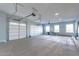 Bright and spacious garage with overhead doors and extra storage at 10226 N 171St Dr, Waddell, AZ 85355