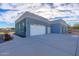 Spacious two-car garage with white doors and ample space at 10226 N 171St Dr, Waddell, AZ 85355